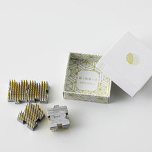 Load image into Gallery viewer, Interlock mini kenzan next to the original box