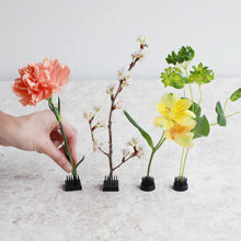 Load image into Gallery viewer, hand decorating mini black kenzan with flowers
