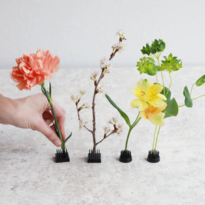 hand decorating mini black kenzan with flowers