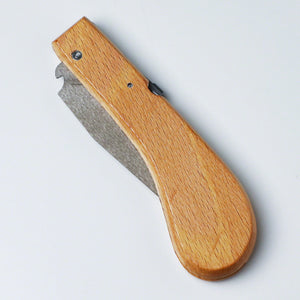 holding saw with the blade closed