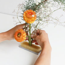 Load image into Gallery viewer, hands arranging  flowers arrnaged on the rectangle kenzan
