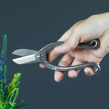 Load image into Gallery viewer, Hand holding the Yaaugi Stainless Ikenobo Scissors
