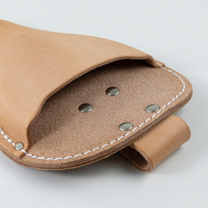 close up on the pokect entry of the leather holster