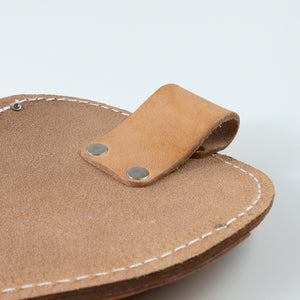 Close up on the loop of the leather holster
