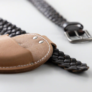 Leather belt inserted in the leather holtser loop